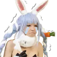 a woman in a bunny costume is crying while holding a carrot in her hand