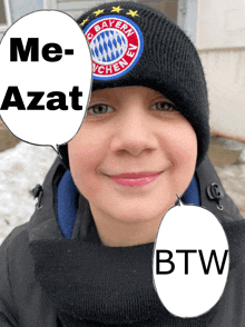 a young boy wearing a bayern munchen beanie is smiling