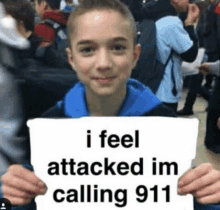 a young boy holds up a sign that says i feel attacked im calling 911