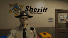 a sheriff from blaine county is standing in front of a sign