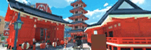 a blurred image of a red building with a blue sky in the background