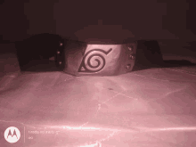 a picture of a belt with a swirl on it