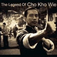 a black and white photo of a man in a karate pose with the words `` the legend of cho kho wie '' .