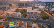 an aerial view of a city with a few buildings and a bridge