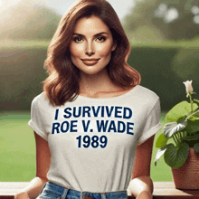 a woman wearing a shirt that says i survived roe v. wade 1989