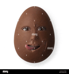 a chocolate egg with a face on it and a tongue sticking out