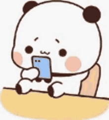 a cartoon panda is sitting at a table holding a cell phone .