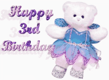 a teddy bear wearing a blue and purple dress with the words happy 3rd birthday