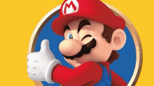 a close up of mario giving a thumbs up on a yellow background .