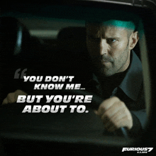 a movie poster for fast and furious 7 shows a man driving a car