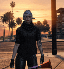 a woman wearing a bandana and a black jacket stands in front of a sunset