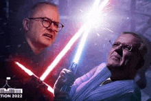 two men are holding lightsabers in their hands .