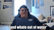 a man in a chair with the words " land whale out of water "