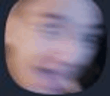 a blurry picture of a person 's face in a circle