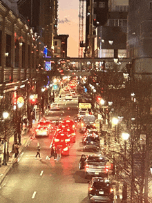 an aerial view of a city street at night with lots of traffic