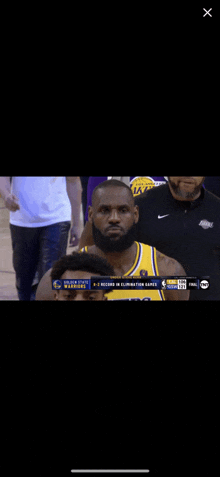 a basketball player with a beard wearing a yellow jersey that says golden state warriors on it