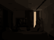 a dark room with a light coming through a doorway