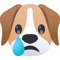 a brown and white dog with a blue tear running down its face