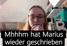 a woman wearing glasses with the words mhhhh hat marius wieder geschrieben