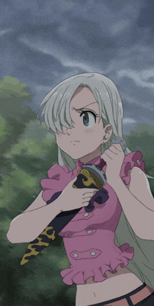 a girl in a pink top is holding a sword in her hand