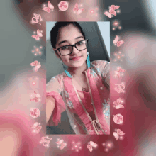 a girl wearing glasses takes a selfie with a pink frame around her