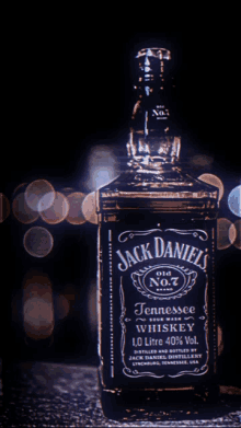 a bottle of jack daniel 's tennessee whiskey is lit up