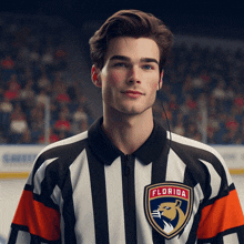 a hockey referee from the florida panthers stands in front of a crowd