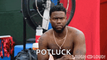 a shirtless man is sitting in front of a fan with the words potluck laugh out loud written on the bottom .