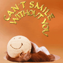 a picture of an orangutan holding a smiley face and the words " can 't smile without you "