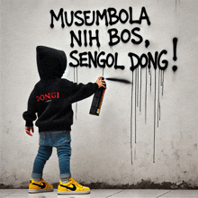 a young boy spray paints graffiti on a wall that says " musembolo nih bos sengol dong "