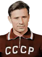 a man wearing a brown sweater with the letters cccp on the front