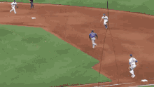 a baseball player wearing a number 24 jersey is throwing a ball .