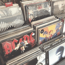 a collection of records including ac/dc and the beatles