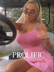 a woman in a pink dress is sitting in a golf cart with the words prolific quarterly on the bottom right