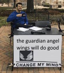 a man sits at a table behind a sign that says change my mind