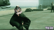 a gif of a cat wearing headphones and a cape with the words gif jif below it