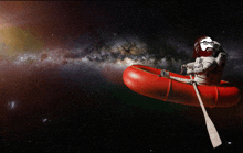 a man in a space suit is rowing a red raft