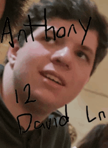 a close up of a man 's face with the name anthony and david written on it