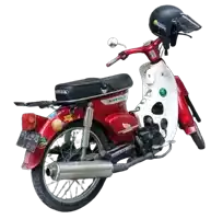 a red and white honda motorcycle with a helmet on top