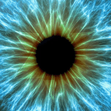 a blue and green eye with a black center