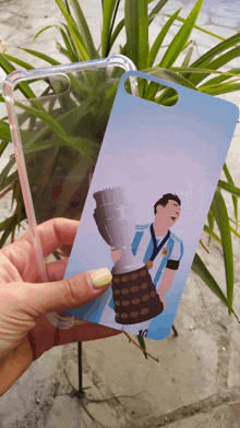 a person is holding a phone case with a picture of a man holding a trophy