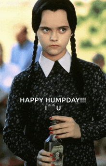 a girl in a black dress is holding a bottle and says happy humpday i love u