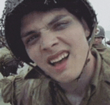 a close up of a man wearing a helmet