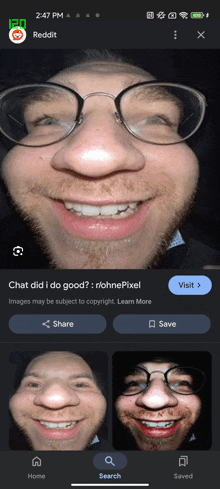 a phone screen shows a man wearing glasses and a beard smiling