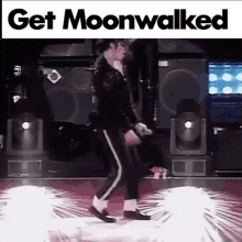 a man is dancing on a stage with the words get moonwalked written above him .