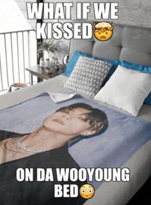 a bed with a blanket with a picture of a man on it and the words what if we kissed on da wooyoung bed