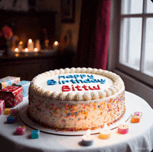 a birthday cake that says happy birthday bittu