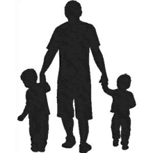 a silhouette of a man holding two children 's hands while walking .