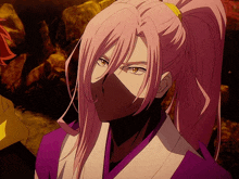 a man with long pink hair and a ponytail wearing a mask