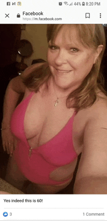 a woman in a pink one piece swimsuit takes a selfie on facebook